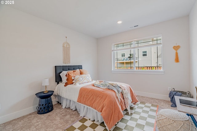 carpeted bedroom with baseboards, visible vents, and recessed lighting