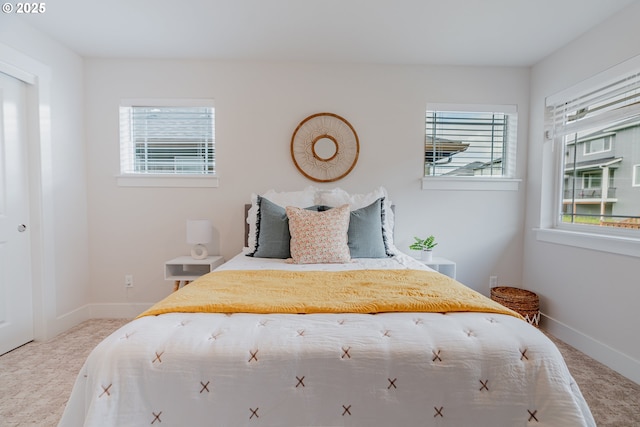 carpeted bedroom with baseboards