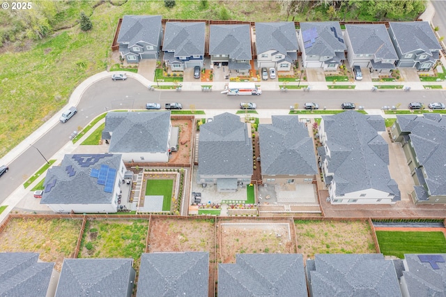 birds eye view of property with a residential view