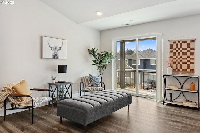 sitting room featuring visible vents and wood finished floors