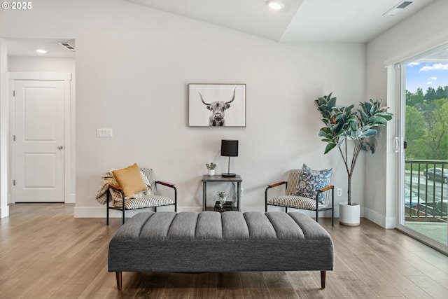 sitting room featuring visible vents, wood finished floors, and recessed lighting