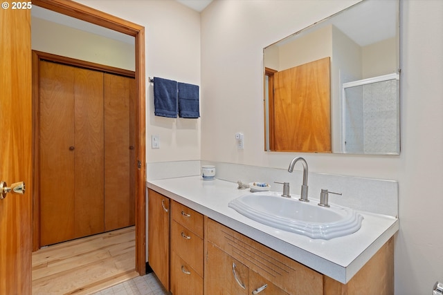 3621 NE 10th St, Otis, OR 97368 - full bath featuring vanity, a shower with door, and wood finished floors