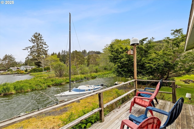3621 NE 10th St, Otis, OR 97368 - wooden deck featuring a water view and a dock