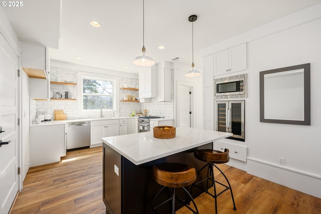 kitchen featuring open shelves, stainless steel appliances, wine cooler, and backsplash