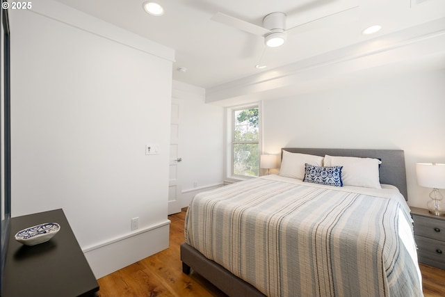bedroom featuring ceiling fan, wood finished floors, and recessed lighting