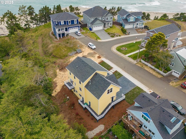 birds eye view of property with a residential view and a water view