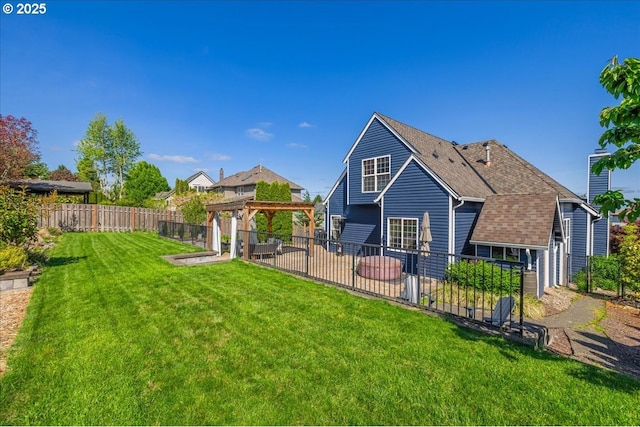 rear view of property with a patio, a fenced backyard, a shingled roof, a gazebo, and a yard