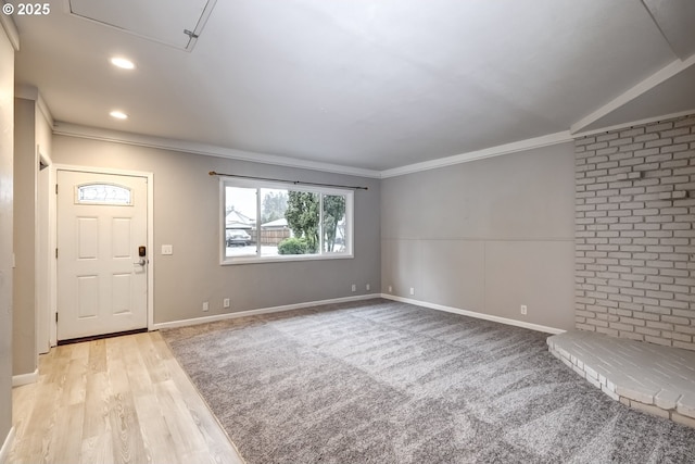 entryway with baseboards, recessed lighting, light wood-style flooring, and crown molding