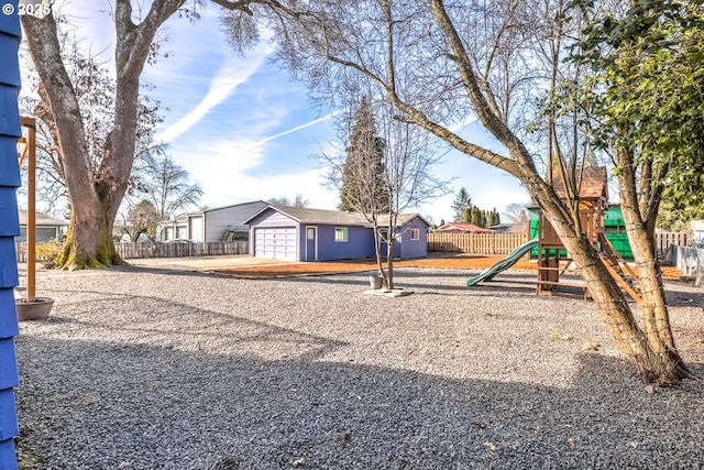 exterior space with fence and an outdoor structure