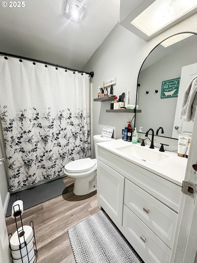 1315 Auburn Ave, Baker City, OR 97814 - full bath featuring wood finished floors, vanity, toilet, and a shower with curtain