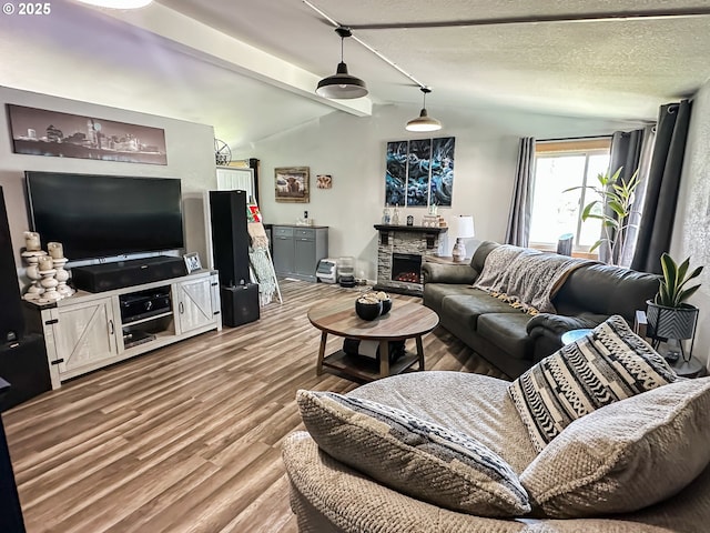 1315 Auburn Ave, Baker City, OR 97814 - living area featuring wood finished floors and a stone fireplace