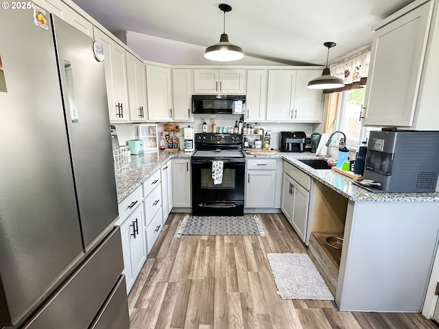 1315 Auburn Ave, Baker City, OR 97814 - kitchen with black appliances, a sink, light wood-style floors, light stone countertops, and lofted ceiling