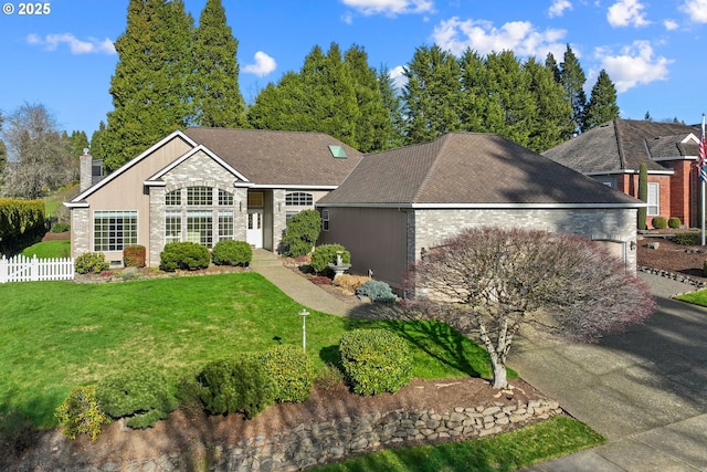 single story home with a garage and a front lawn