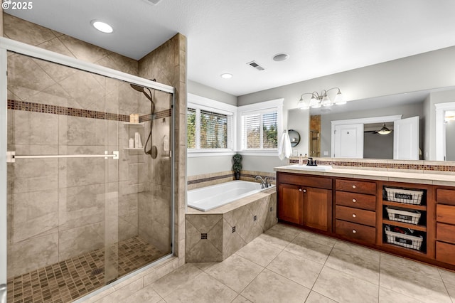 bathroom featuring a stall shower, visible vents, tile patterned floors, vanity, and a bath