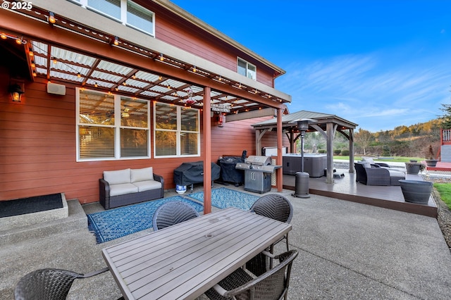 view of patio / terrace with outdoor lounge area, a grill, a gazebo, outdoor dining space, and a hot tub