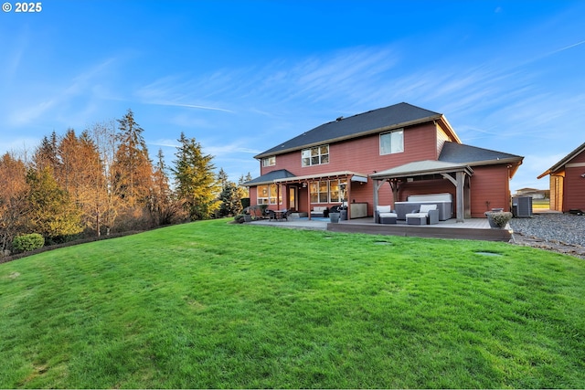 rear view of property featuring a wooden deck, a hot tub, a yard, a gazebo, and an outdoor living space