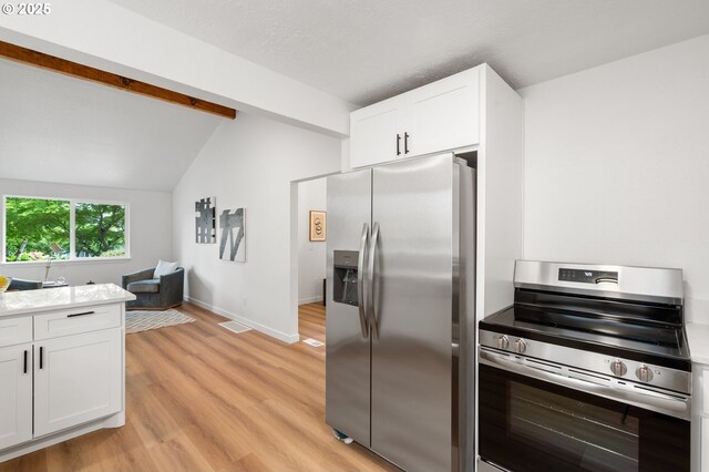 6300 SW Arranmore Pl, Portland, OR 97223 - kitchen featuring appliances with stainless steel finishes, light wood-style floors, white cabinetry, and light countertops