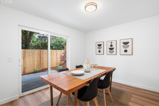 6300 SW Arranmore Pl, Portland, OR 97223 - dining space with baseboards and wood finished floors