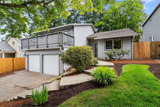 6300 SW Arranmore Pl, Portland, OR 97223 - view of front of property with a balcony, a garage, driveway, and roof with shingles