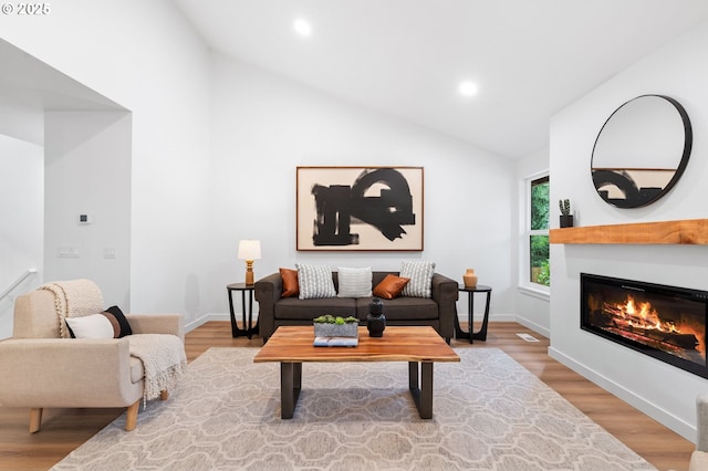 6300 SW Arranmore Pl, Portland, OR 97223 - living room with a glass covered fireplace, recessed lighting, high vaulted ceiling, and wood finished floors