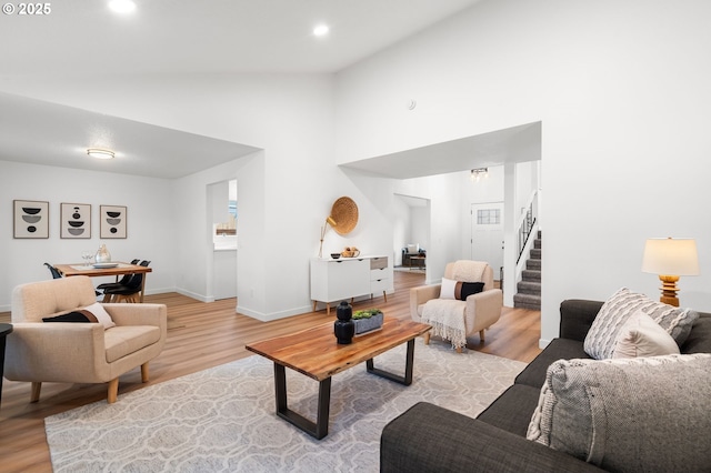 6300 SW Arranmore Pl, Portland, OR 97223 - living room with light wood-type flooring, stairway, recessed lighting, and high vaulted ceiling