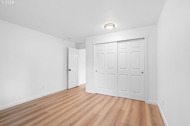 6300 SW Arranmore Pl, Portland, OR 97223 - unfurnished bedroom with light wood-type flooring and a closet