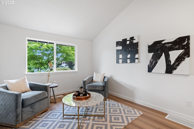 6300 SW Arranmore Pl, Portland, OR 97223 - sitting room featuring lofted ceiling and wood finished floors