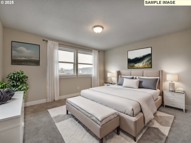 bedroom featuring light carpet and baseboards