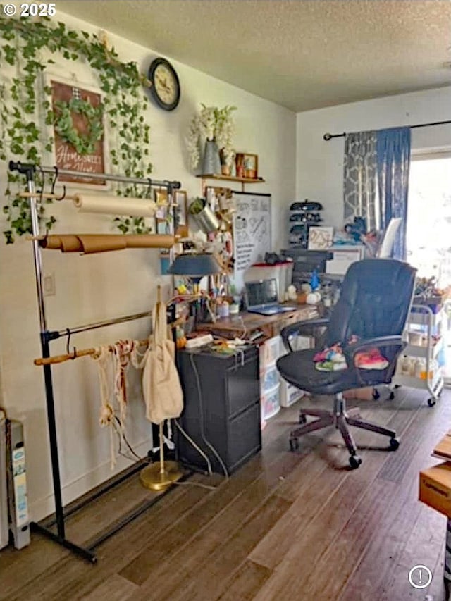 home office featuring a textured ceiling and hardwood / wood-style flooring