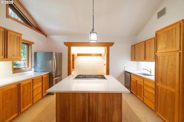 5070 Fox Hollow Rd, Eugene, OR 97405 - kitchen with vaulted ceiling, light carpet, stainless steel appliances, a center island, and light countertops