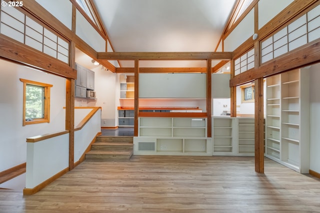 5070 Fox Hollow Rd, Eugene, OR 97405 - unfurnished living room with wood finished floors and high vaulted ceiling
