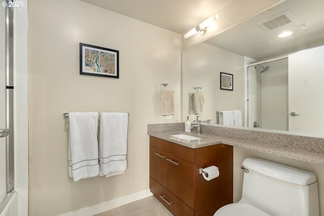 full bathroom with vanity, tile patterned floors, enclosed tub / shower combo, and toilet