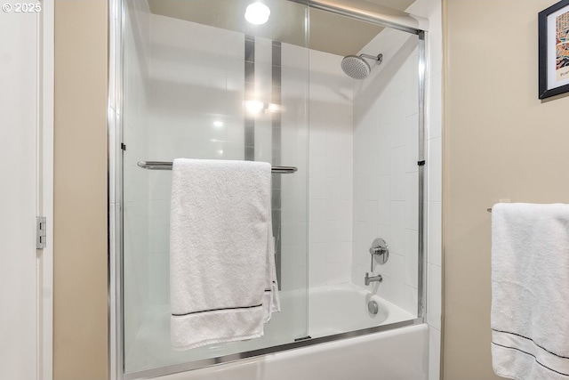 bathroom featuring shower / bath combination with glass door