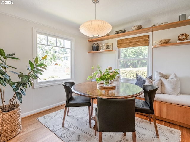 3556 NE Alberta Ct, Portland, OR 97211 - dining area with plenty of natural light, light wood-type flooring, and baseboards