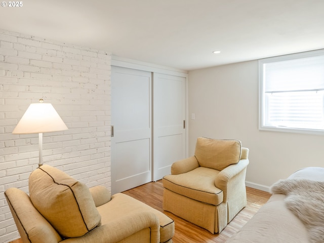 3556 NE Alberta Ct, Portland, OR 97211 - sitting room featuring light wood-style floors, baseboards, brick wall, and recessed lighting