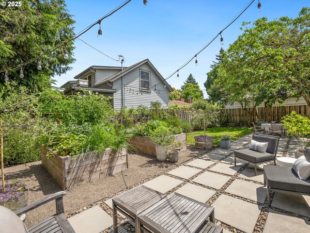 3556 NE Alberta Ct, Portland, OR 97211 - fenced backyard featuring a garden, a patio area, and outdoor dining area