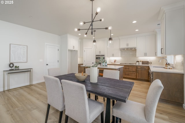 143 W 20th Way, La Center, WA 98629 - dining area featuring light wood-type flooring, a chandelier, and recessed lighting