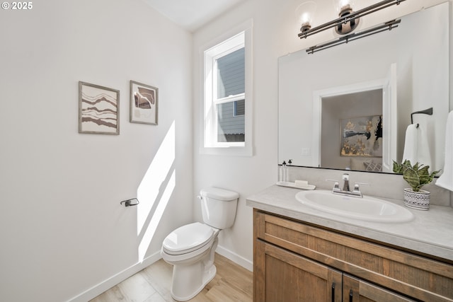 143 W 20th Way, La Center, WA 98629 - half bathroom featuring vanity and wood finished floors