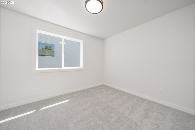 143 W 20th Way, La Center, WA 98629 - carpeted spare room featuring baseboards