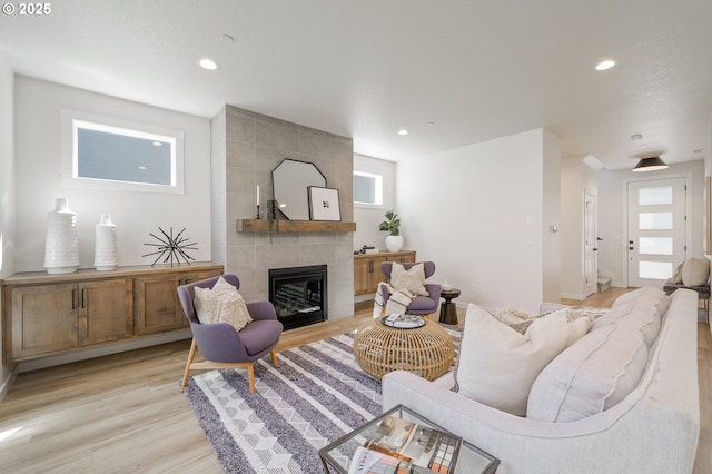 143 W 20th Way, La Center, WA 98629 - living room with light wood-style flooring, a fireplace, and recessed lighting