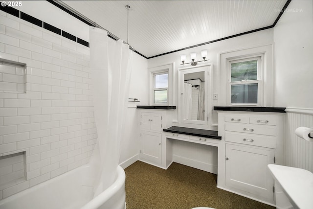 bathroom featuring vanity, ornamental molding, and shower / bath combo