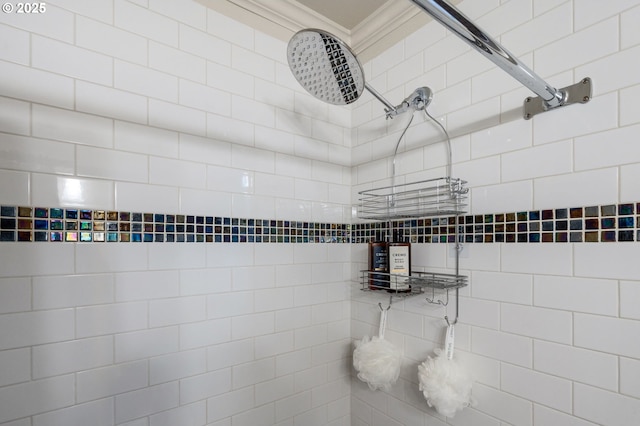 room details featuring ornamental molding and a shower