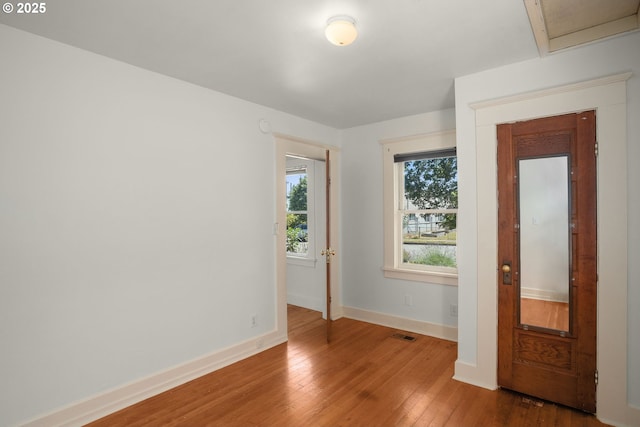 9465 N Midway Ave, Portland, OR 97203 - spare room with wood-type flooring and baseboards