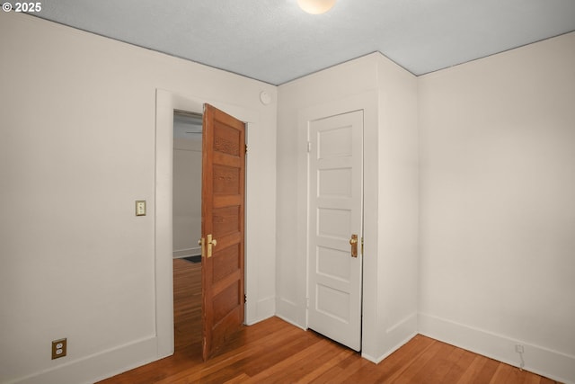 9465 N Midway Ave, Portland, OR 97203 - empty room featuring light wood-style flooring and a textured ceiling