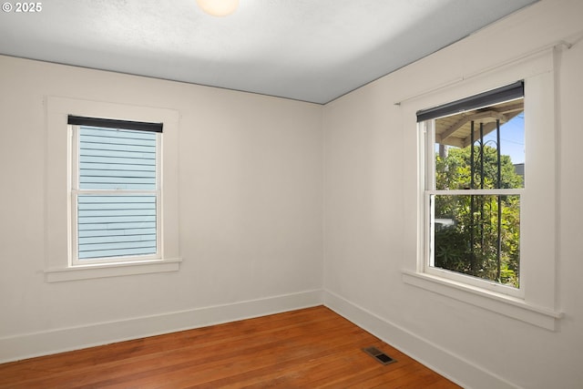 9465 N Midway Ave, Portland, OR 97203 - spare room featuring wood finished floors and baseboards