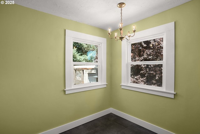 9465 N Midway Ave, Portland, OR 97203 - spare room featuring a chandelier and a textured ceiling