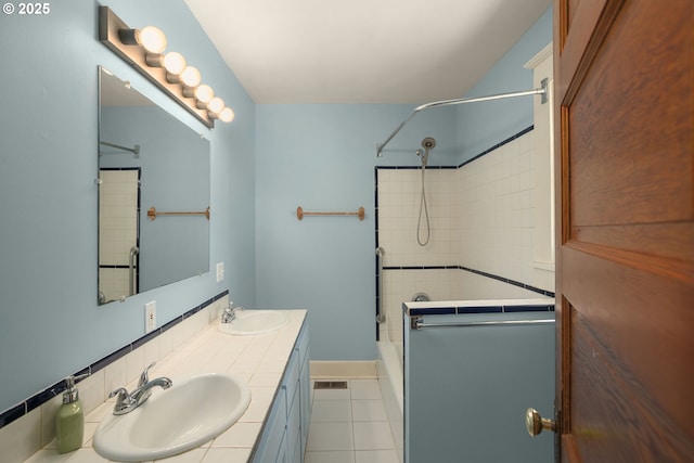 9465 N Midway Ave, Portland, OR 97203 - full bathroom featuring shower / bath combination, double vanity, and tile patterned floors
