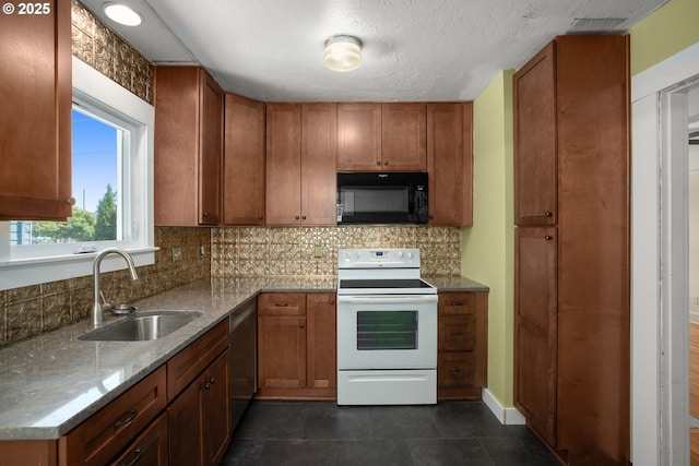 9465 N Midway Ave, Portland, OR 97203 - kitchen with white electric range oven, black microwave, brown cabinetry, and stainless steel dishwasher