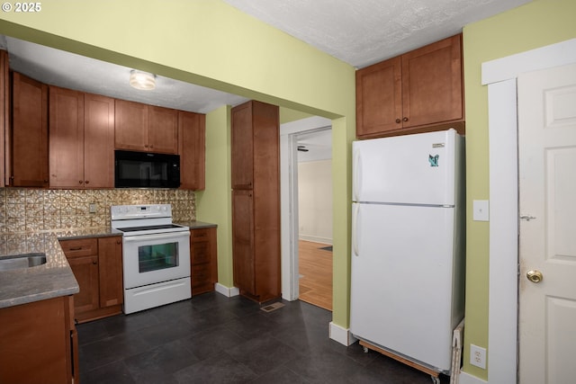 9465 N Midway Ave, Portland, OR 97203 - kitchen featuring white appliances, tasteful backsplash, a textured ceiling, and brown cabinets
