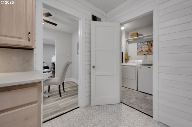 laundry area featuring separate washer and dryer, an office area, and ceiling fan